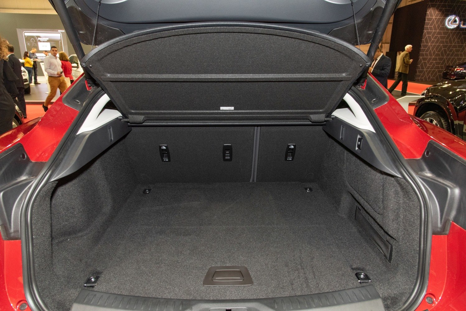 Spacious rear trunk cargo area with fold-down seat latches