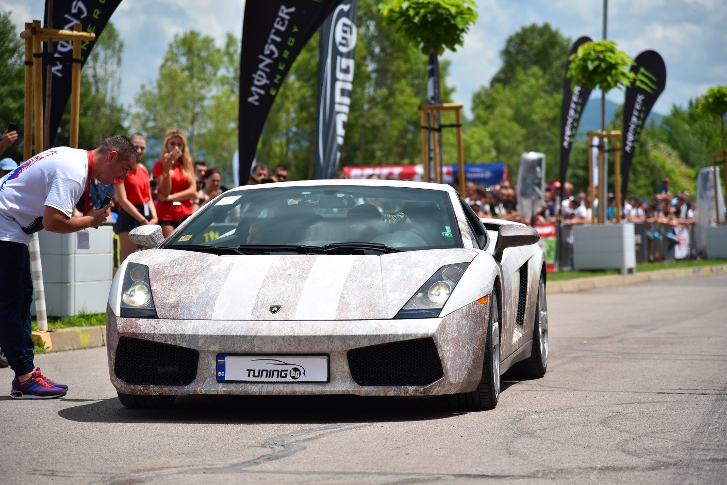 Front view of Lamborghini with weathered striped paint wrap