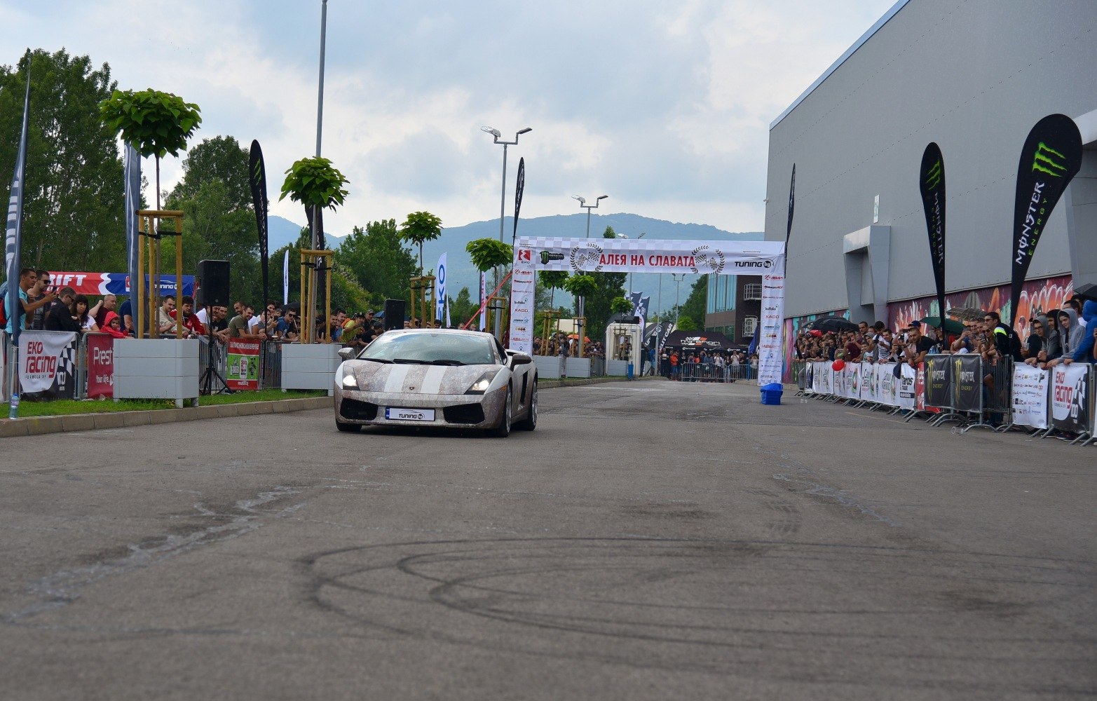 Front view of sleek sports coupe at motorsport event