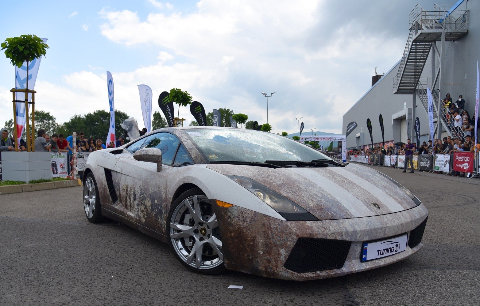 Rust-textured wrapped Lamborghini Gallardo Coupe at car event