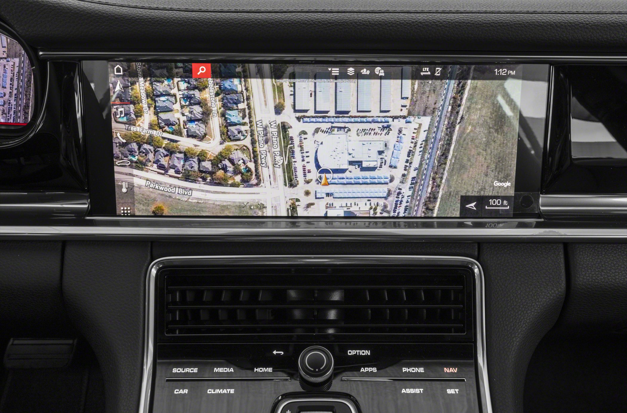 High-res navigation touch display and control panel inside luxury sedan