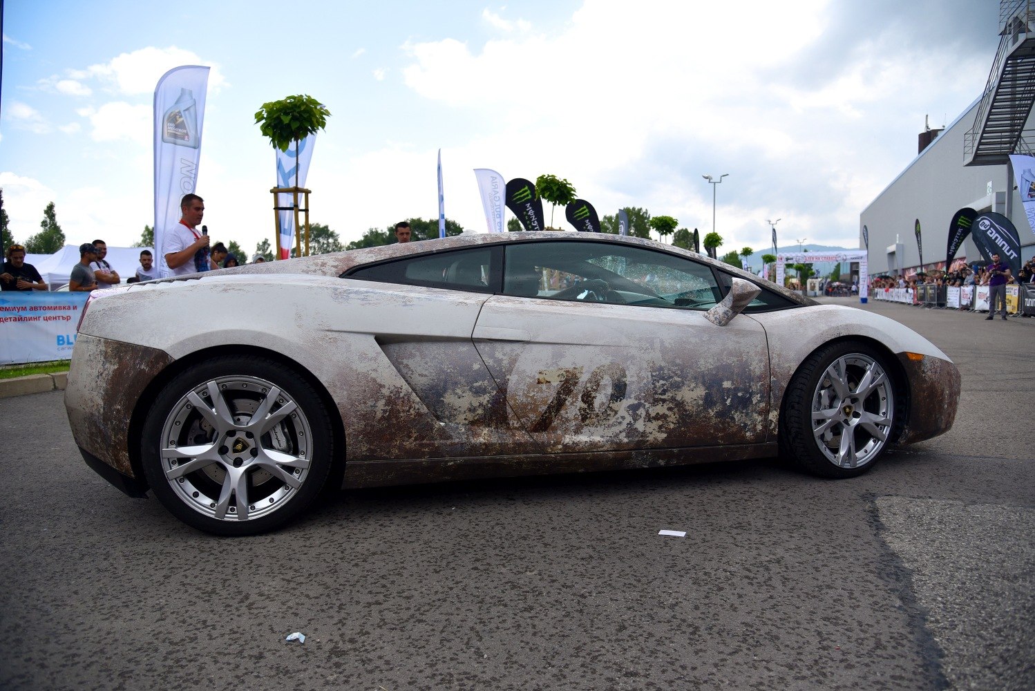 Rust and dirt-covered sports coupe with number 70