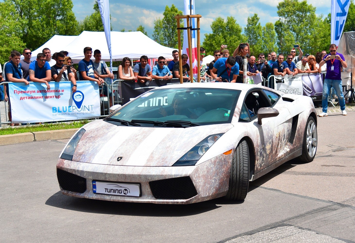 Front view of a Lamborghini Gallardo Coupe with weathered finish
