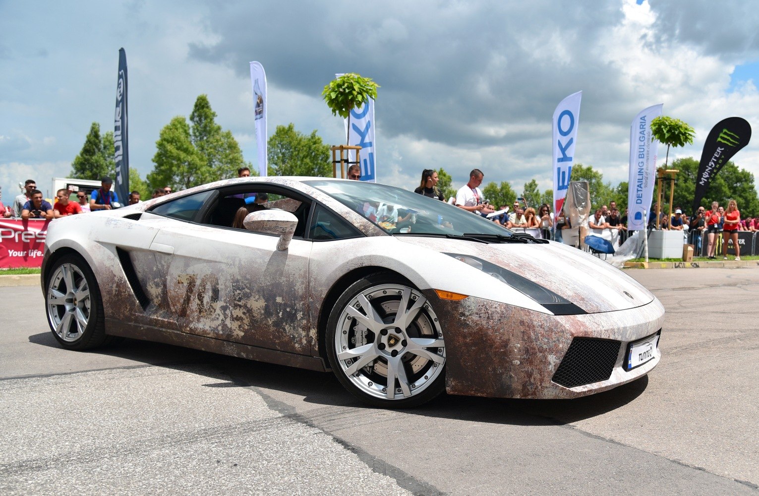 Luxury coupe with patina exterior and large alloy wheels