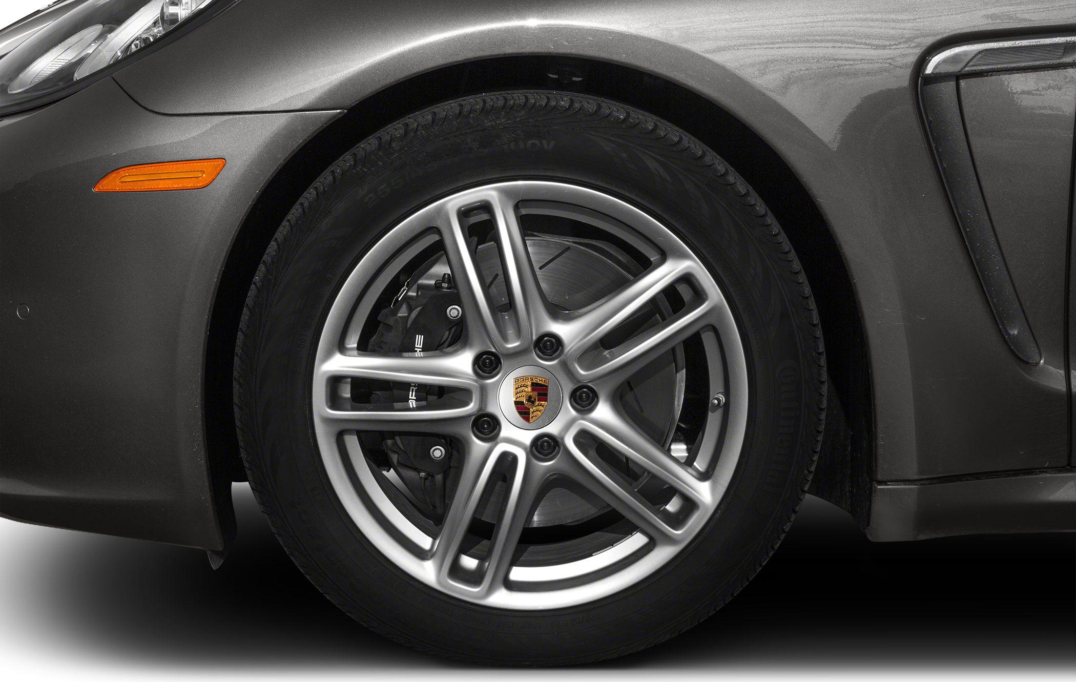 Close-up of a luxury front alloy wheel with performance brake caliper and tire