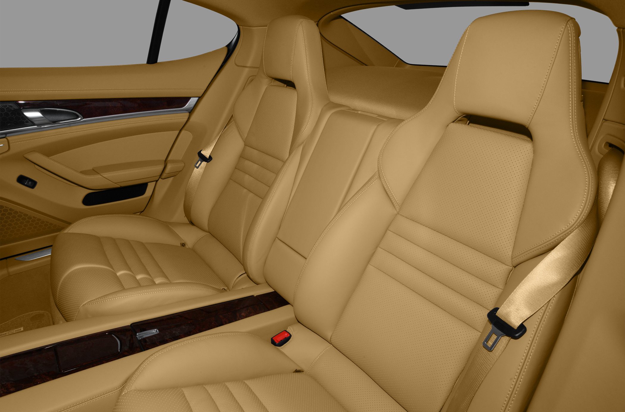 Beige leather rear seats with wood trim in luxury car interior