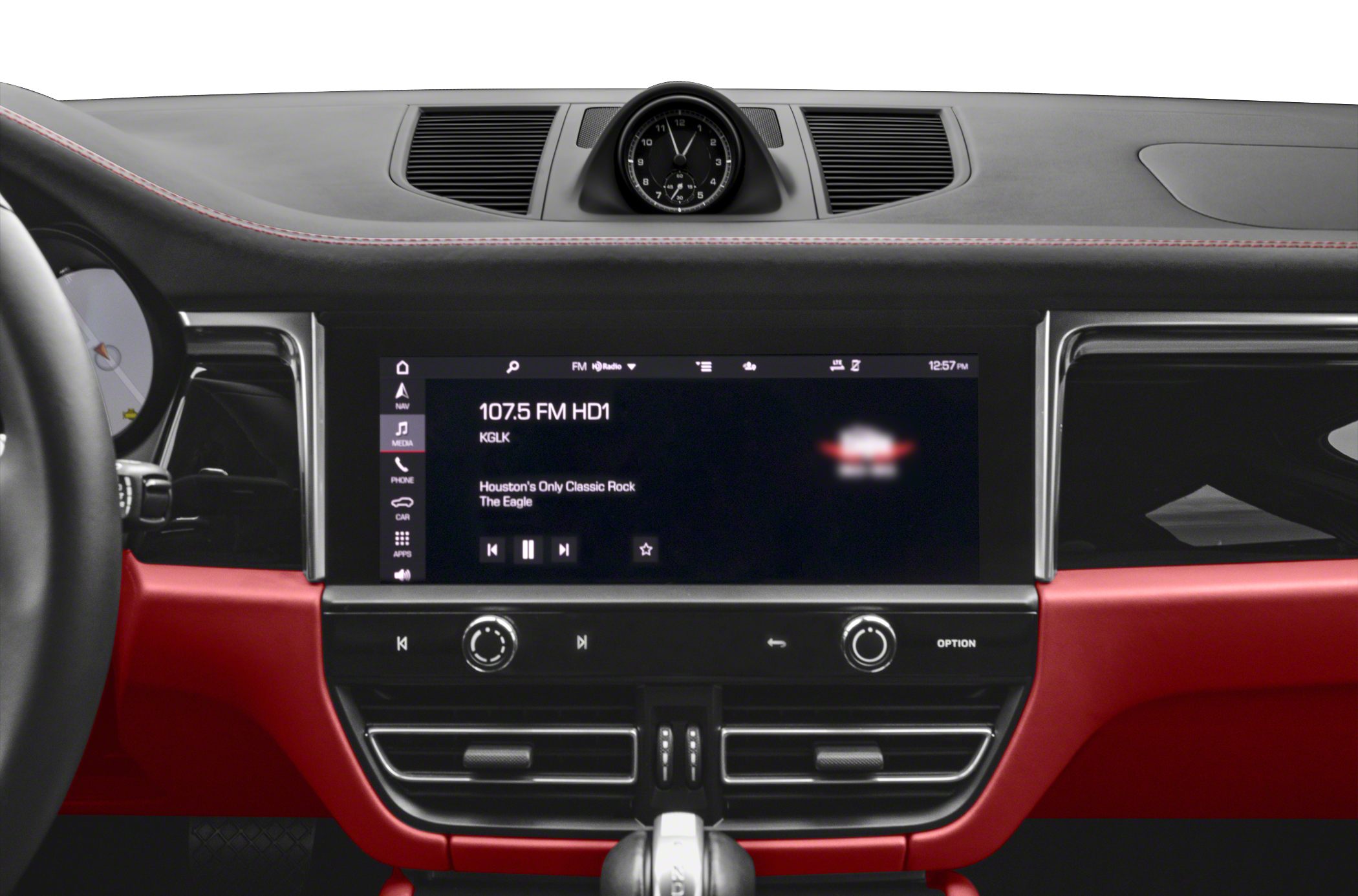 Central infotainment touchscreen, analog clock, air vents, red and black dashboard trim