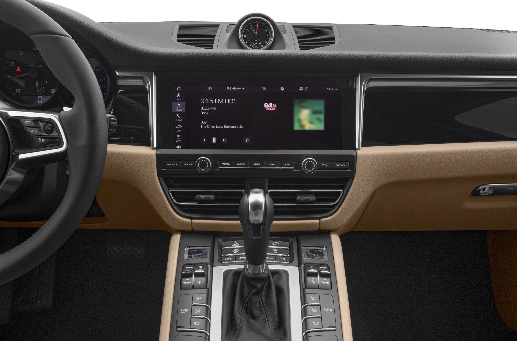 Touchscreen infotainment, gear shifter, analog clock, and dual climate controls