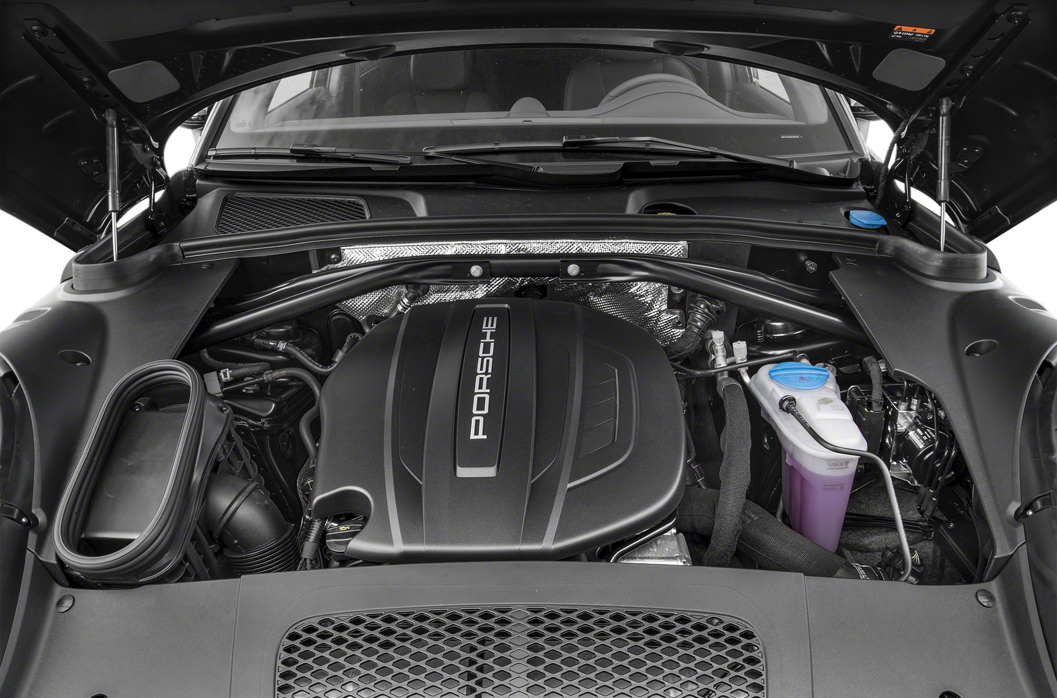 Engine bay with Porsche-branded engine cover and fluid reservoirs
