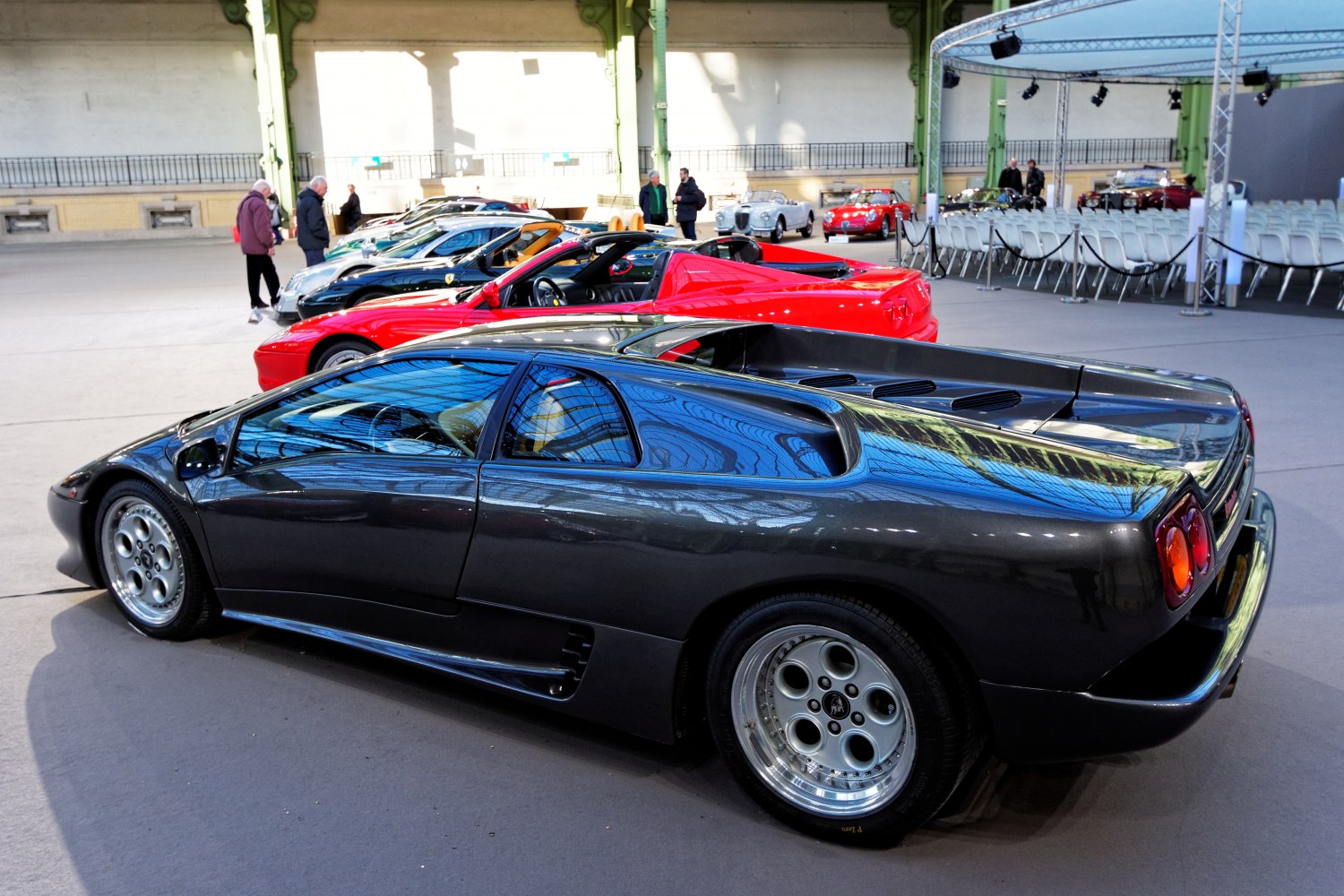 Rear side profile with sleek bodywork and distinctive Lamborghini-style wheels