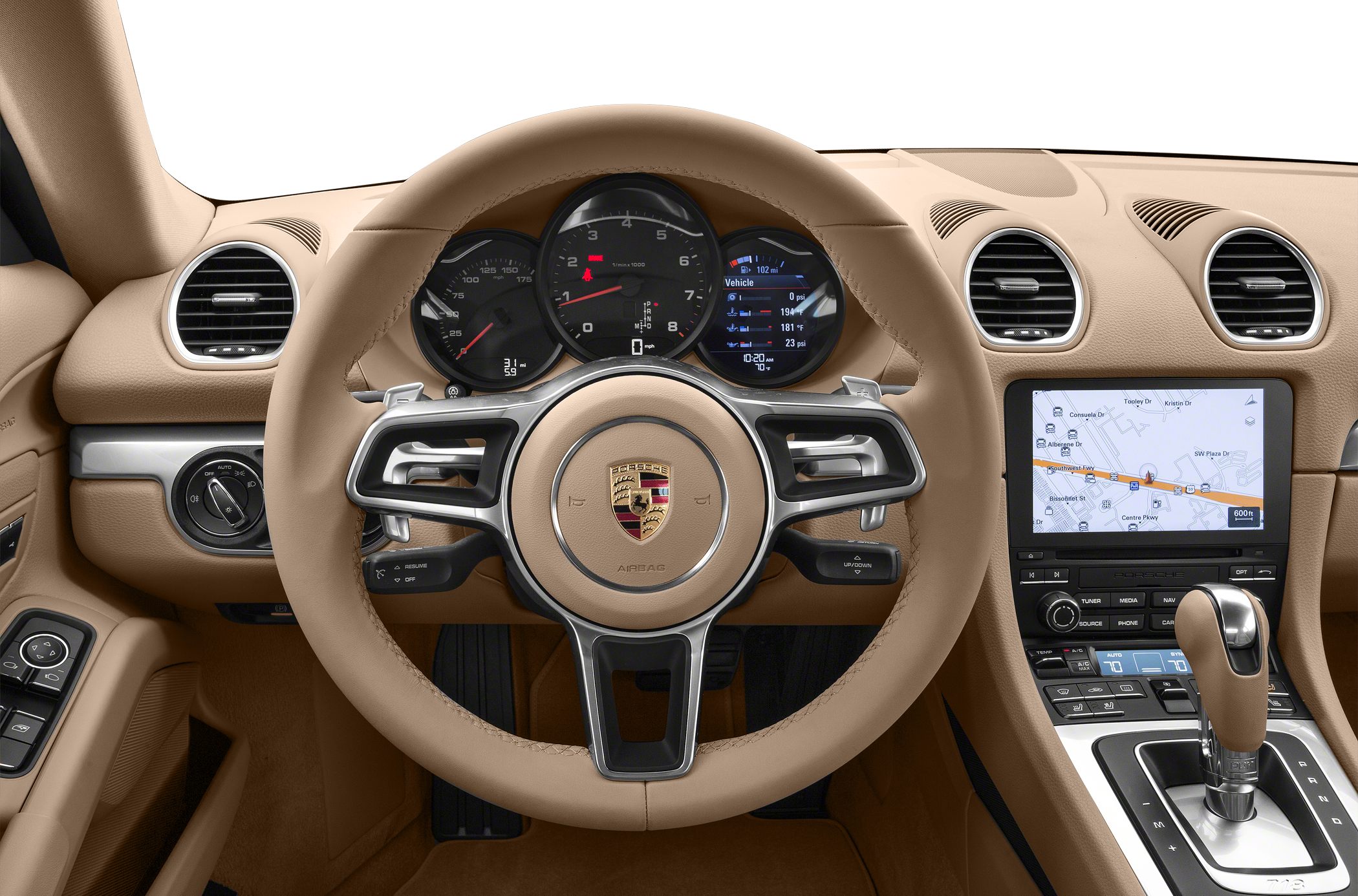 Steering wheel, instrument cluster, and central navigation screen in a tan interior