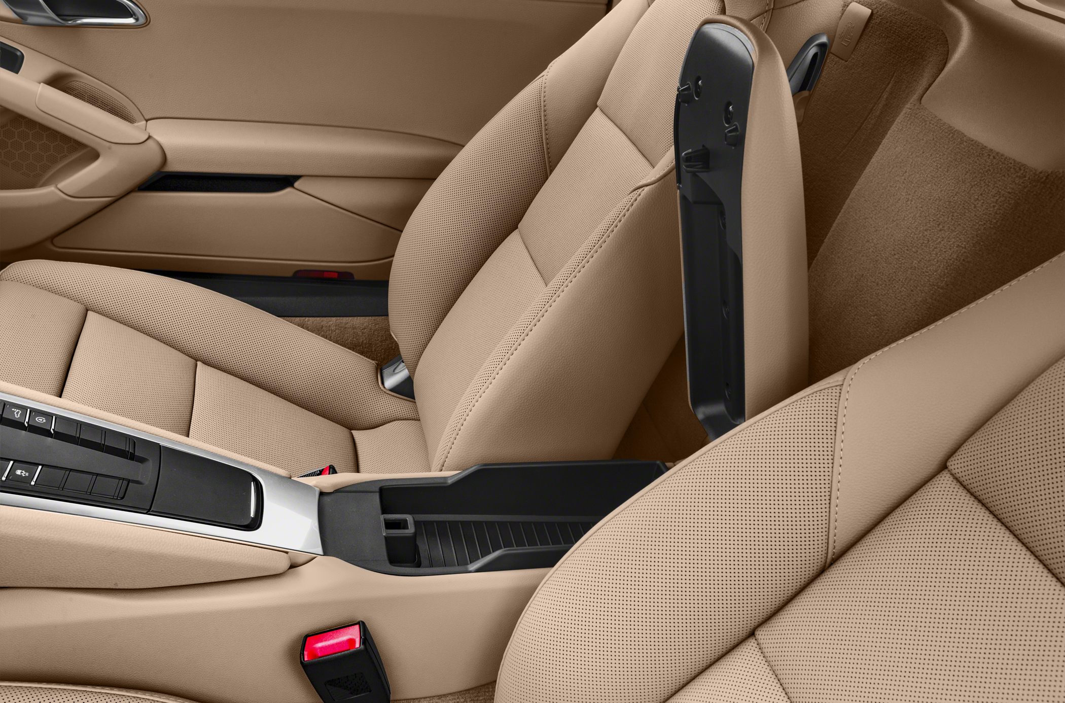 Beige perforated leather seats with opened center console storage