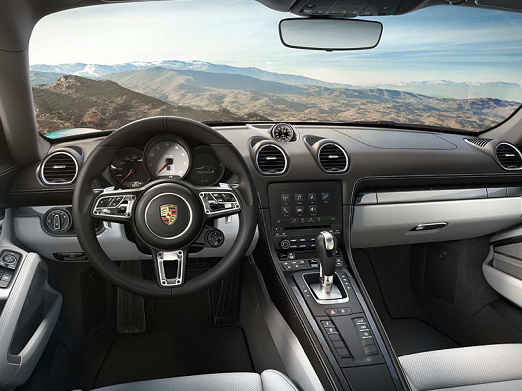 Dashboard, steering wheel, and center console with digital displays