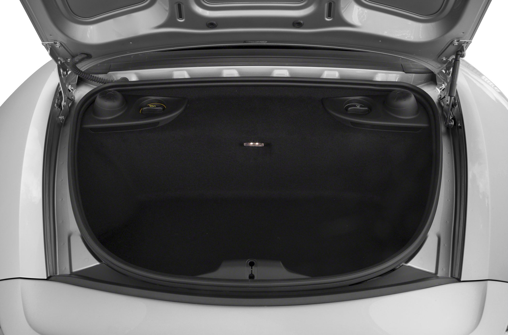 Front trunk showing spacious black luggage compartment and storage details