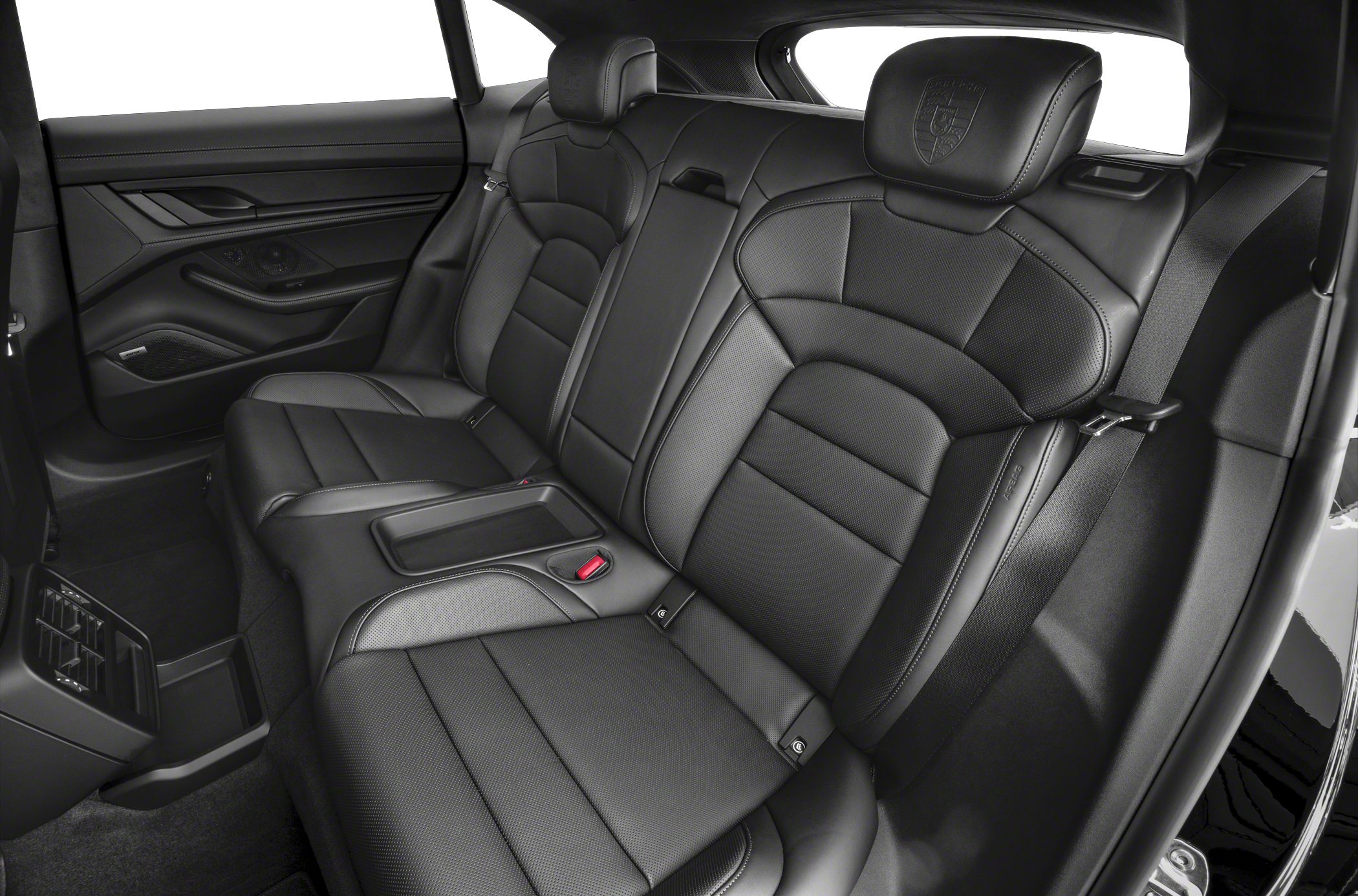 Rear luxury leather seats with embossed headrests and modern car interior design.