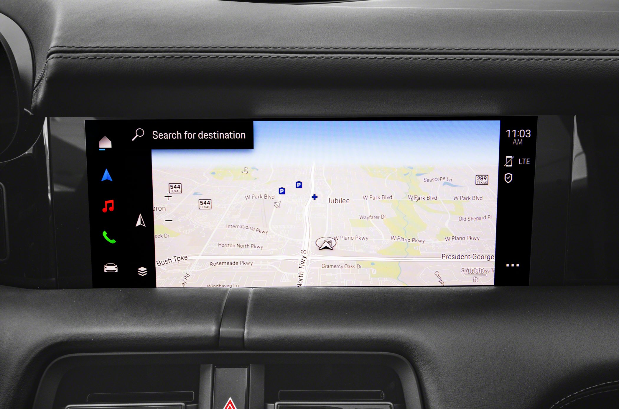 Touchscreen navigation display with search and multimedia icons in car dashboard