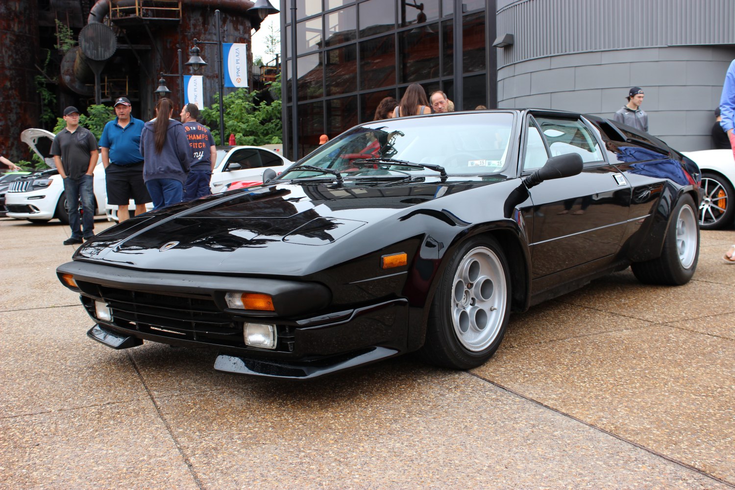 Black vintage sports car with wide body and front fog lights