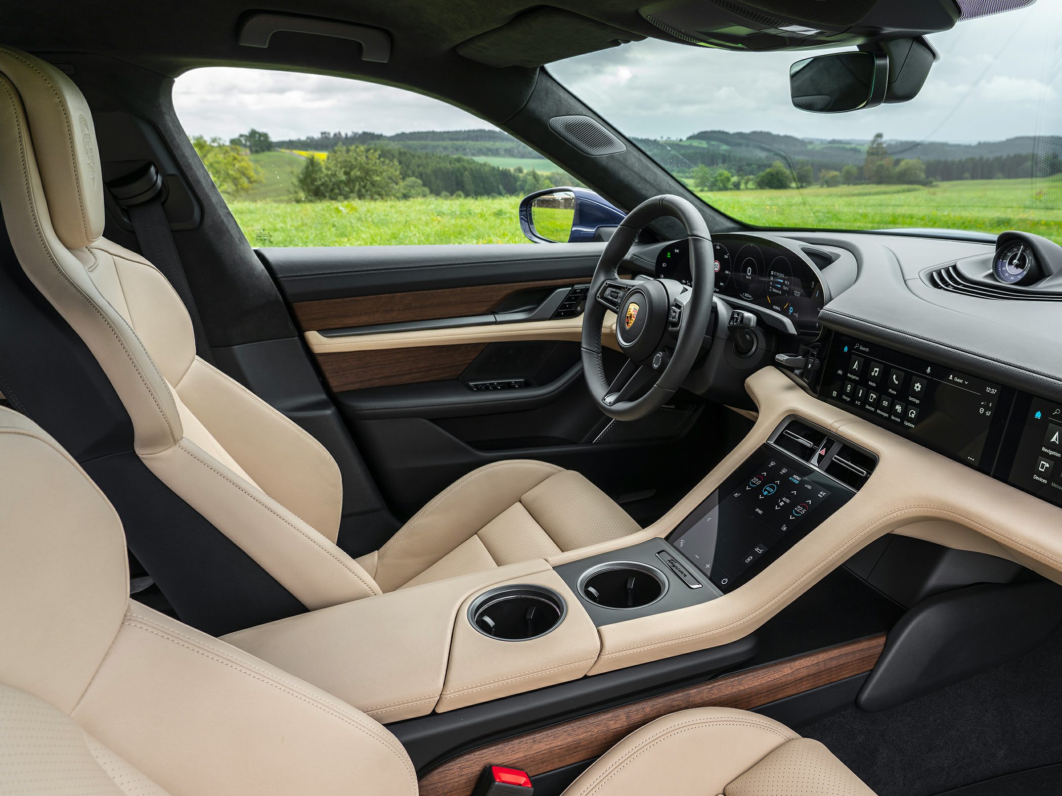 Luxurious beige leather interior with digital dashboard and touchscreen controls
