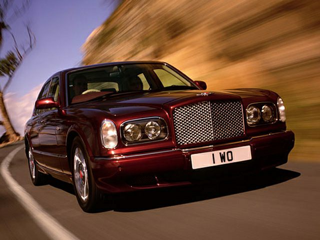 Vintage luxury sedan with classic grille and quad headlights