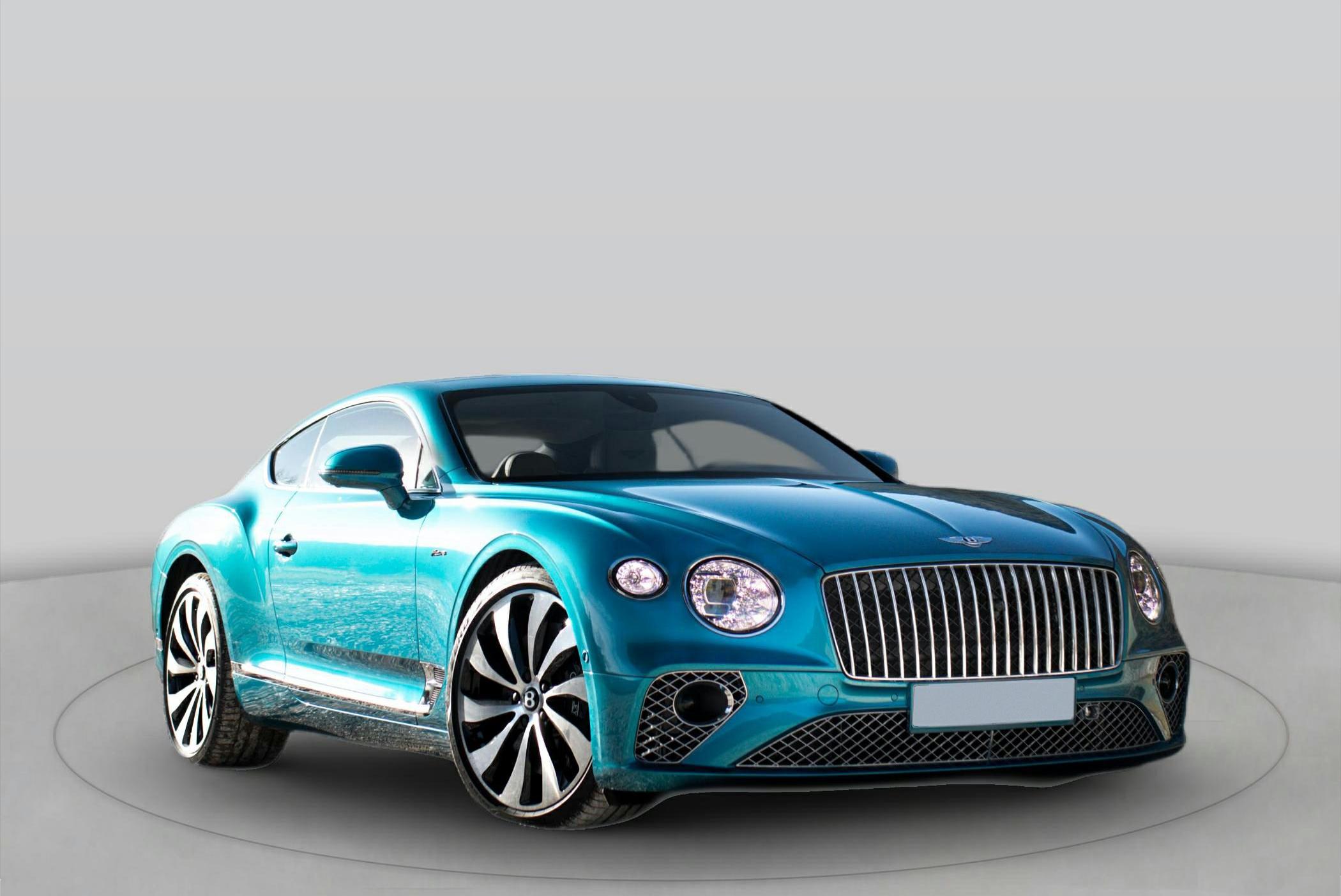 Oval headlights, vertical grille, aerodynamic luxury sports coupe front