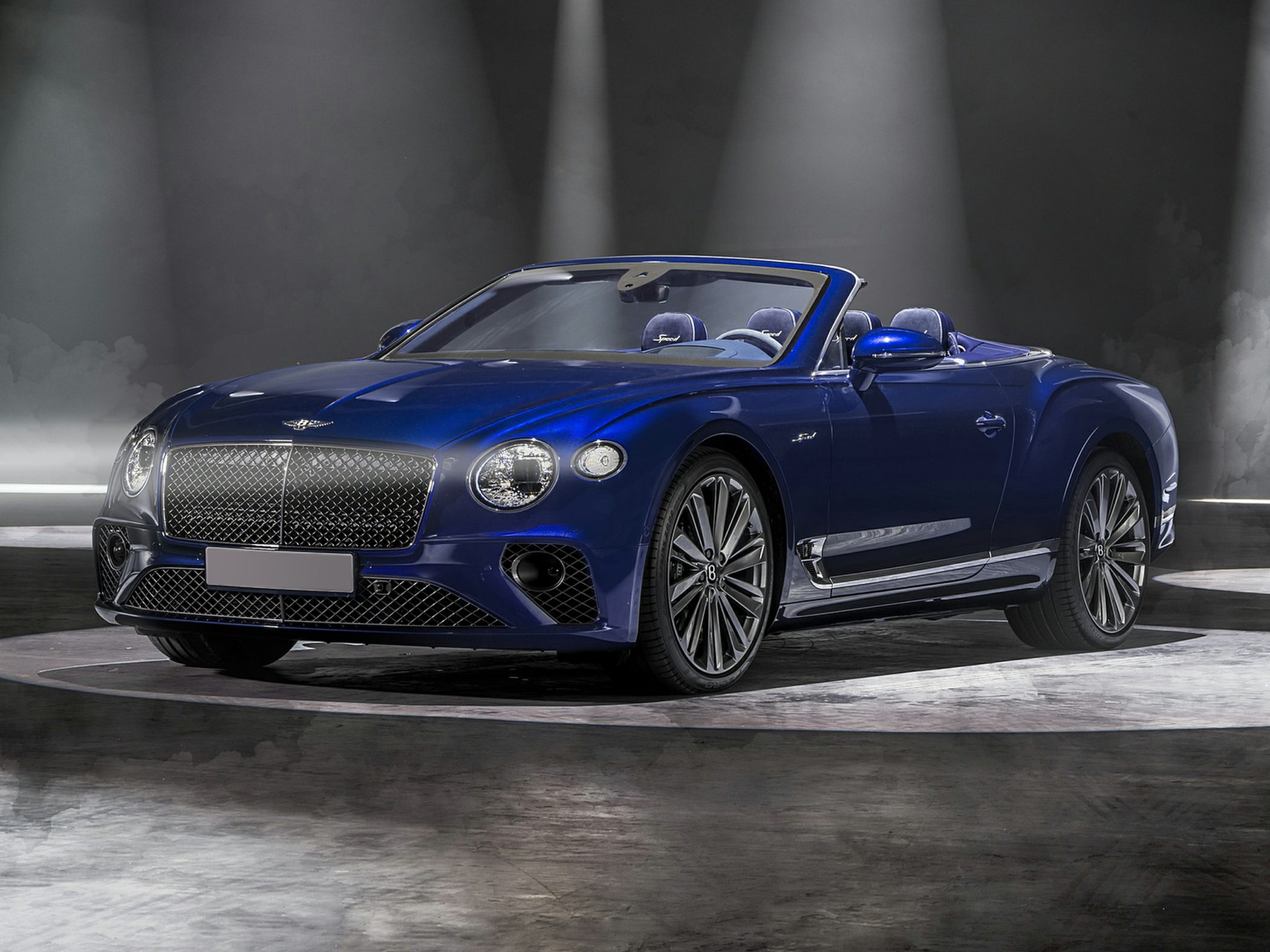 Blue luxury convertible with signature mesh grille and premium wheels
