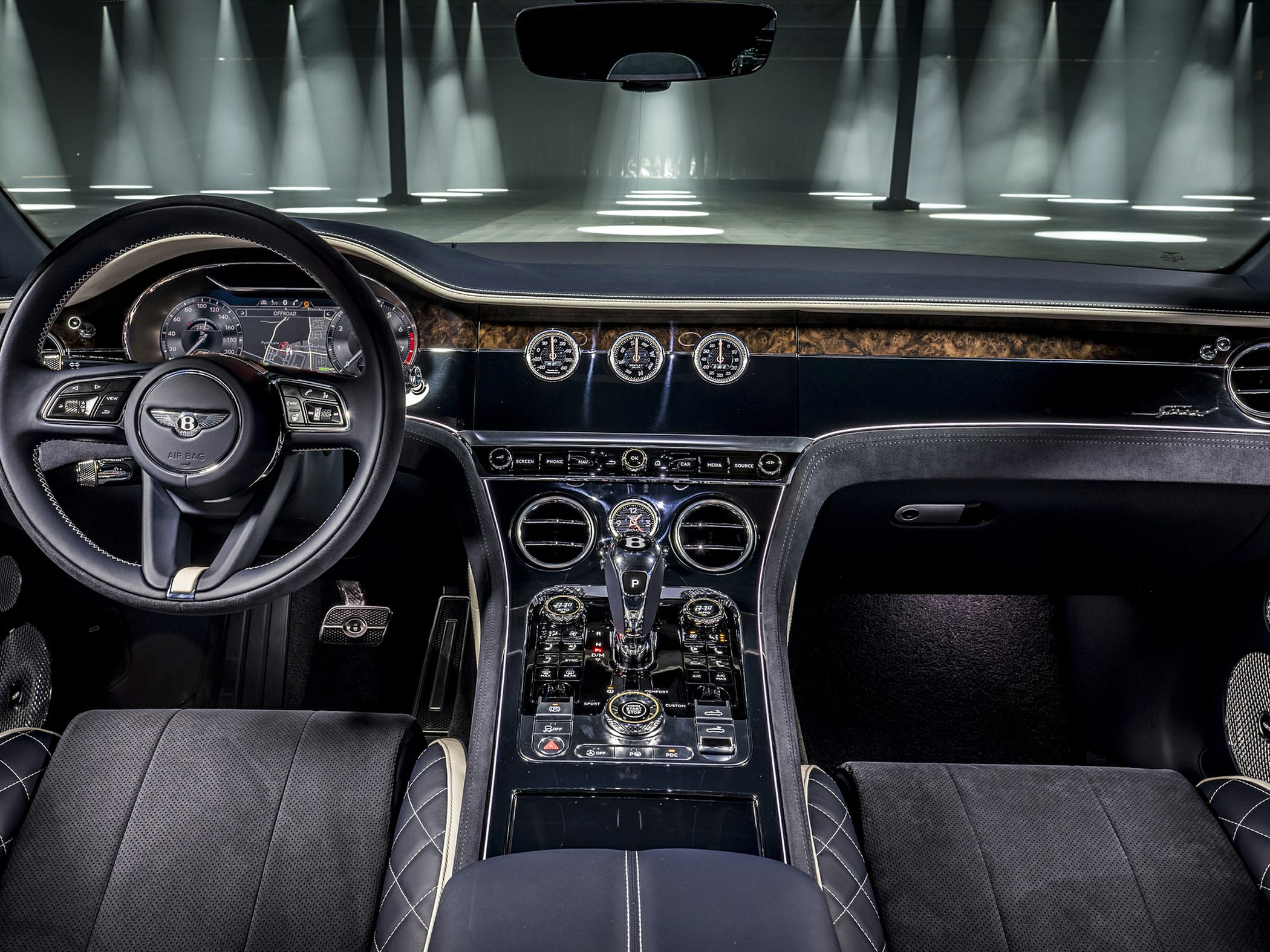 Luxury car interior with premium wood trim and advanced control center