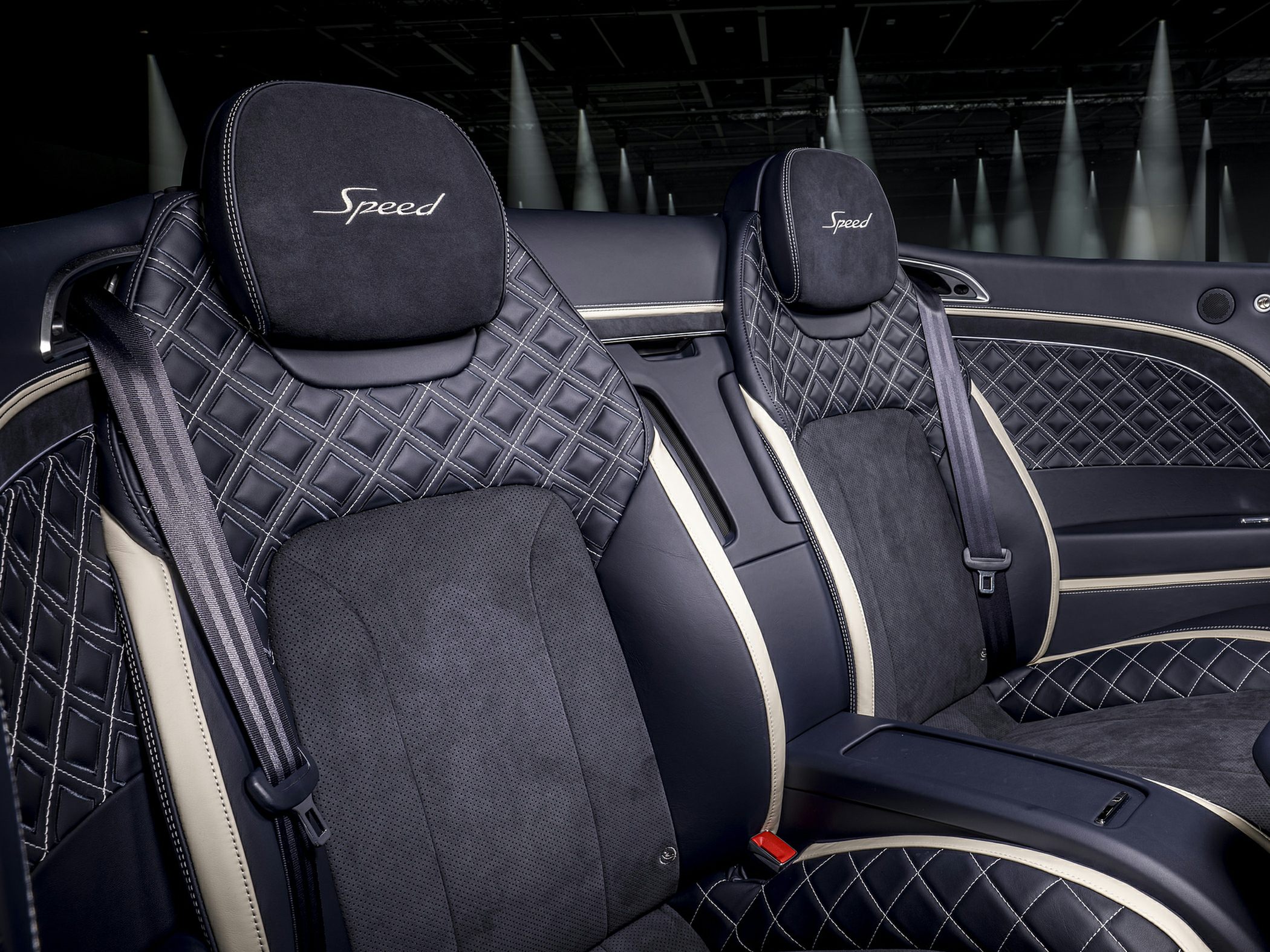 Diamond-quilted black leather seats with Speed embroidery.