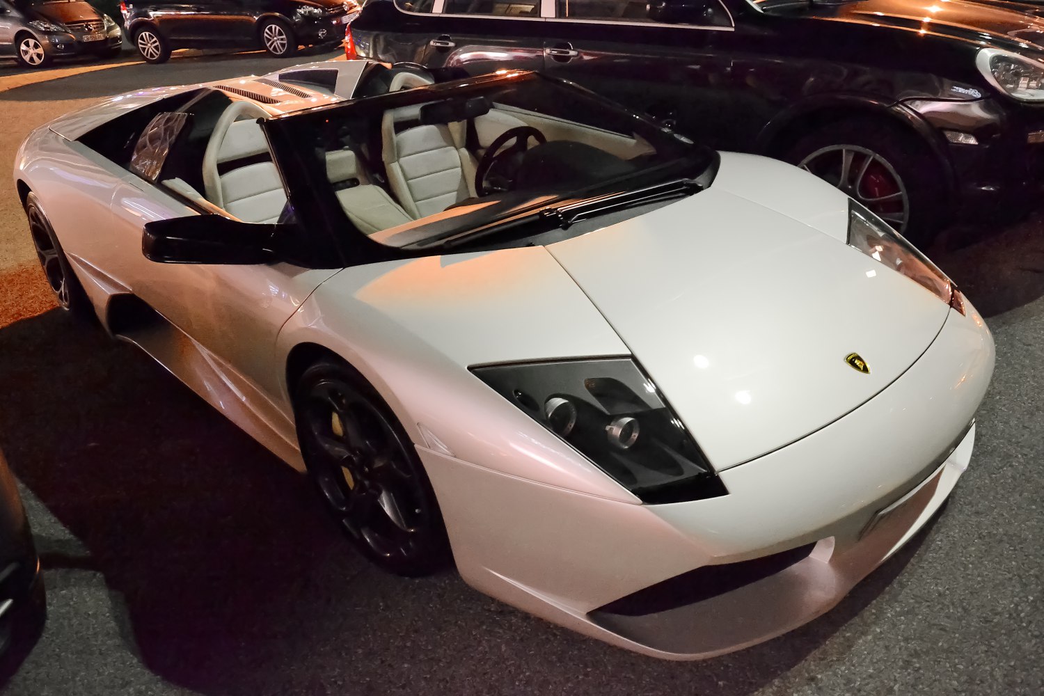 Open-top convertible supercar with detailed front headlights and interior seating