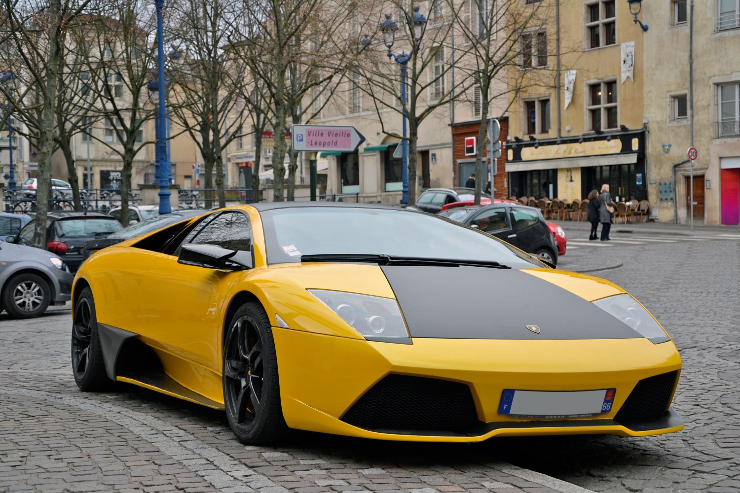 Yellow Lamborghini Murcielago LP640 with black hood and black wheels
