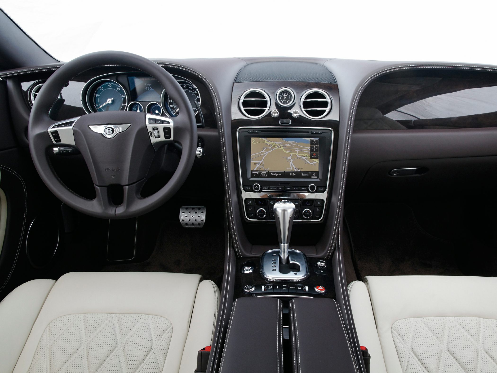 Luxury car interior with navigation system and analog clock