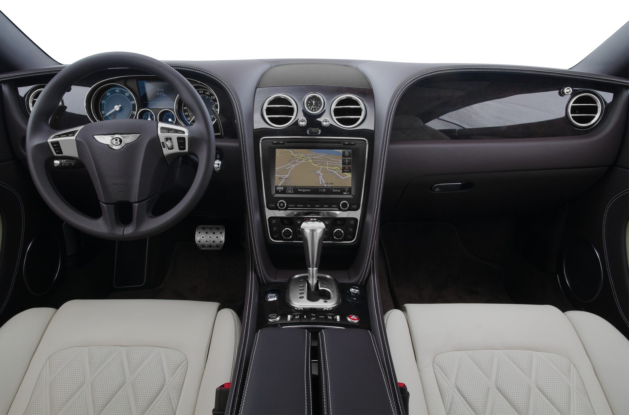 Luxury steering wheel, navigation display, center console with gear shifter and clock