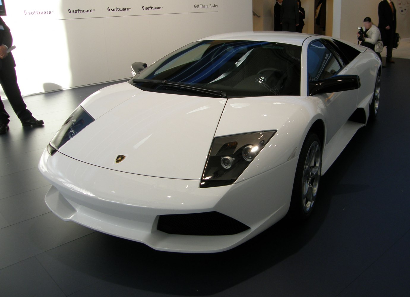 Front angle with sharp headlights and aerodynamic hood.