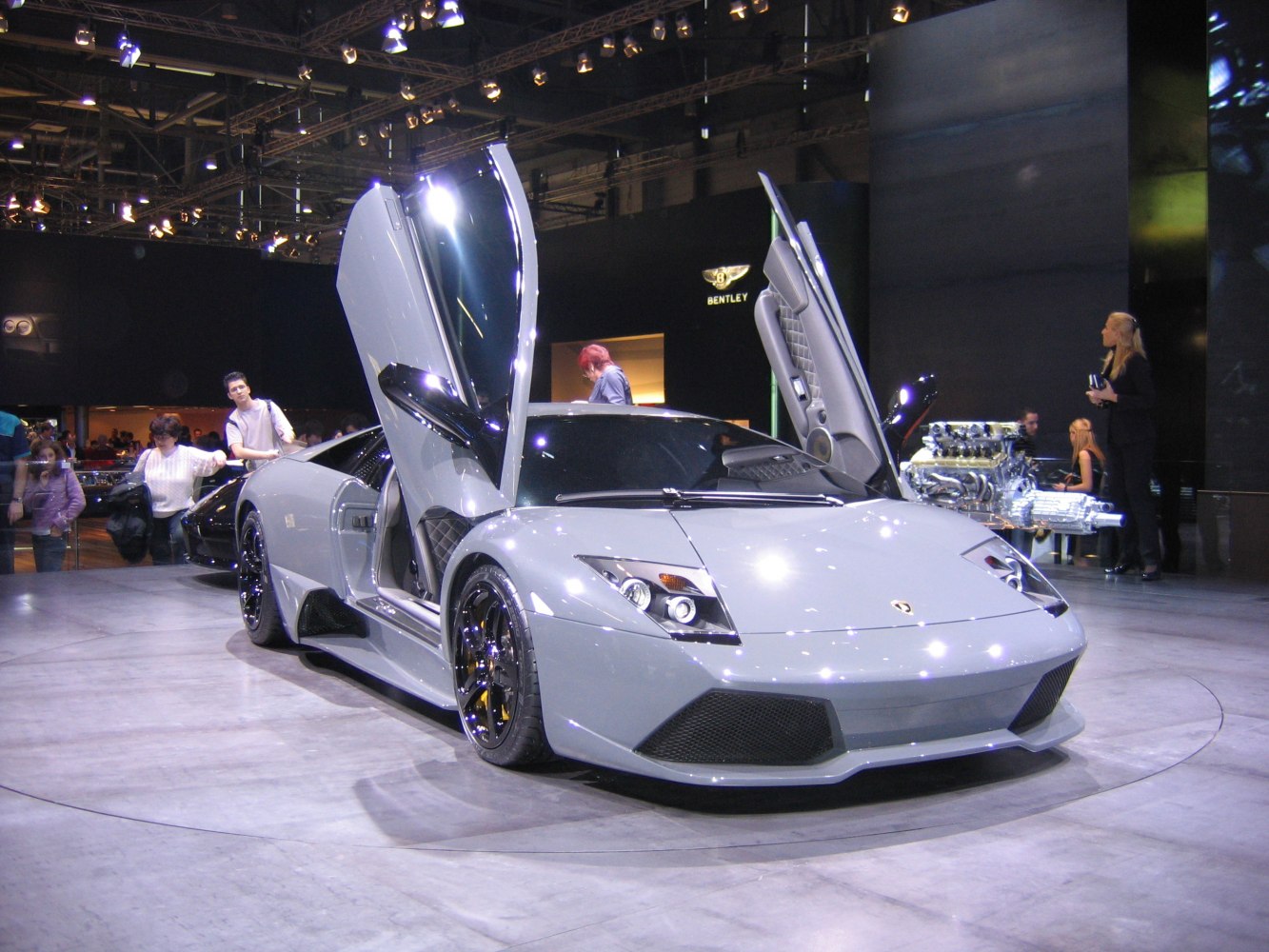 Supercar with signature scissor doors and aggressive aerodynamic front design