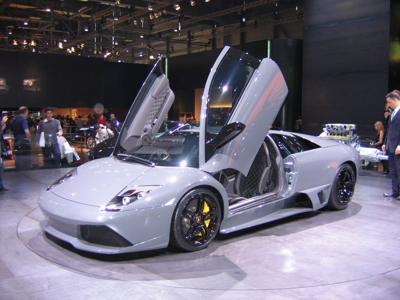 Scissor doors and black alloy wheels on a high-performance sports car