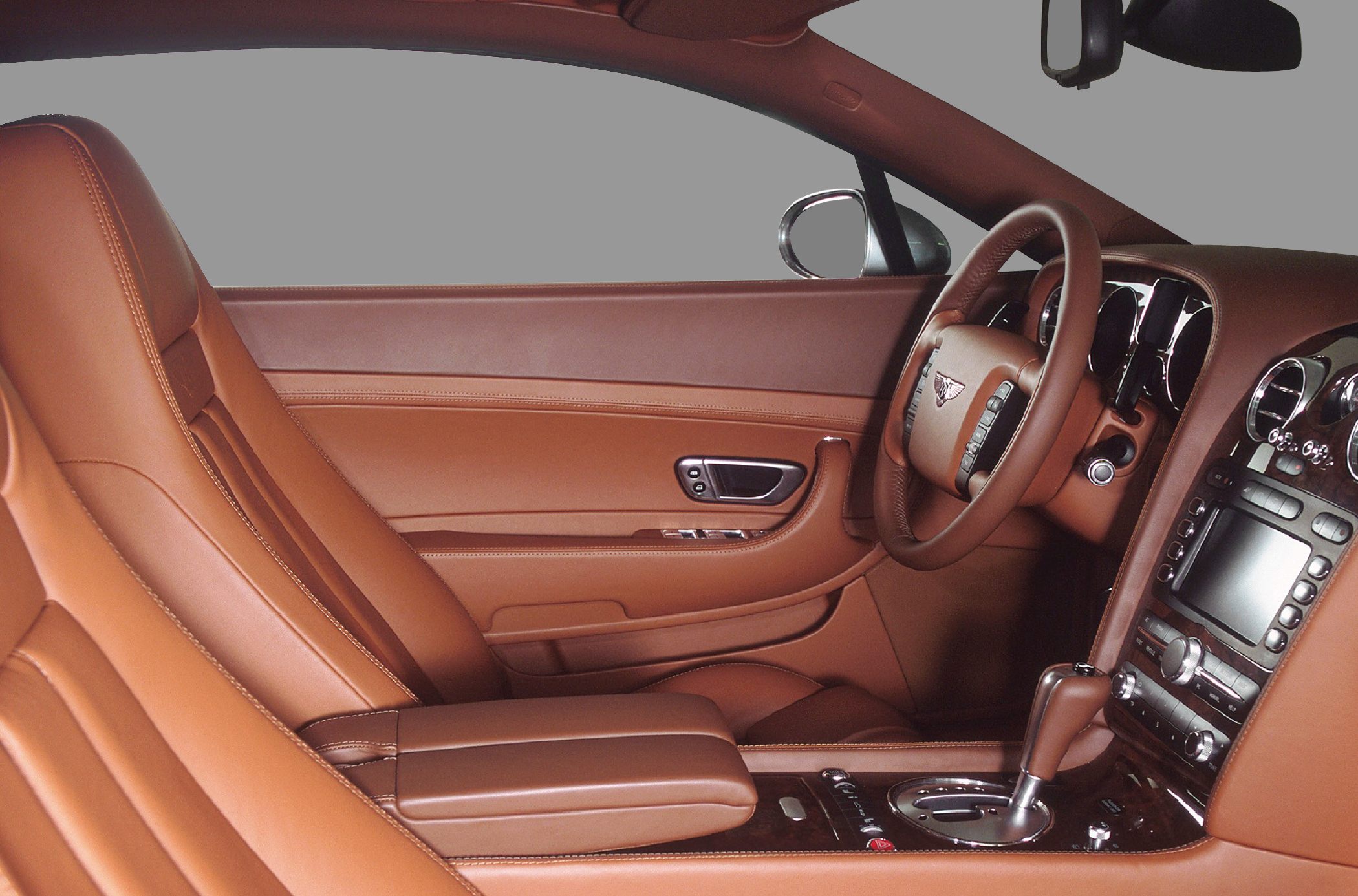 Luxury interior with leather seats, steering wheel, and dashboard