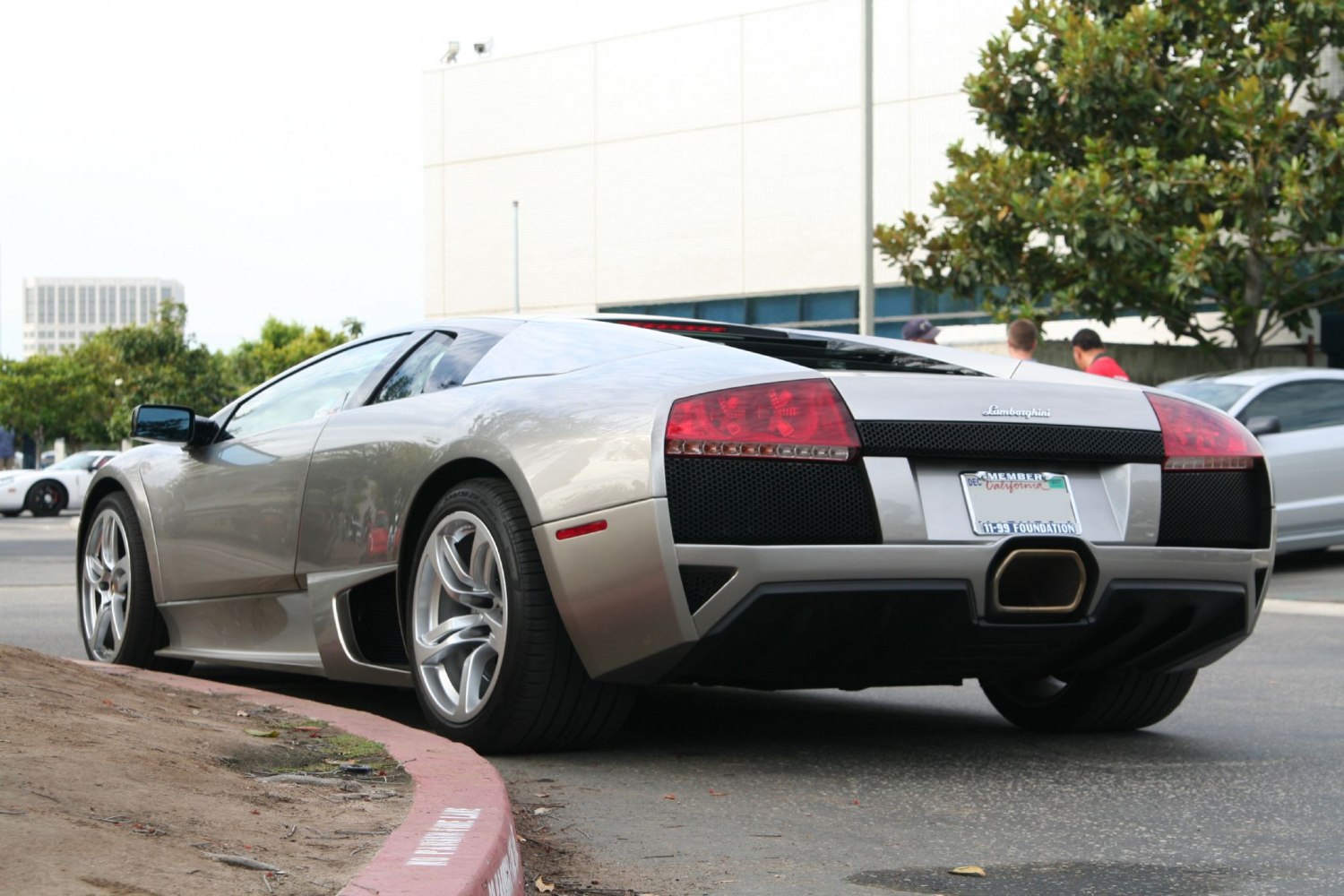 Rear view with distinct taillights and trapezoidal exhaust