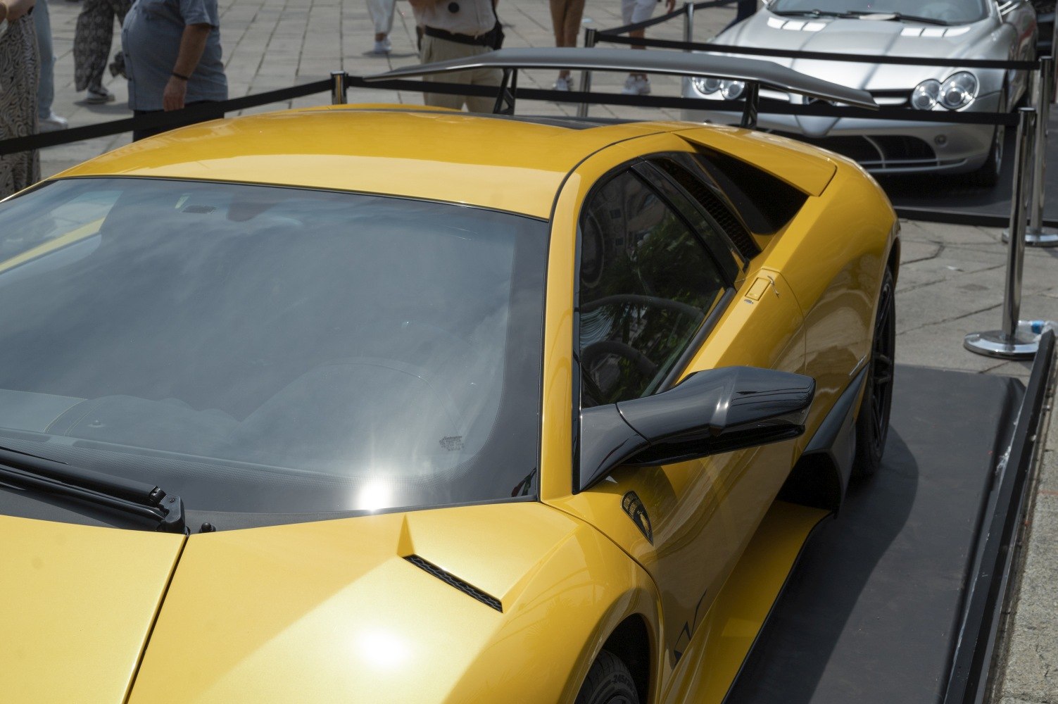 Yellow sports car with carbon side mirror and rear spoiler
