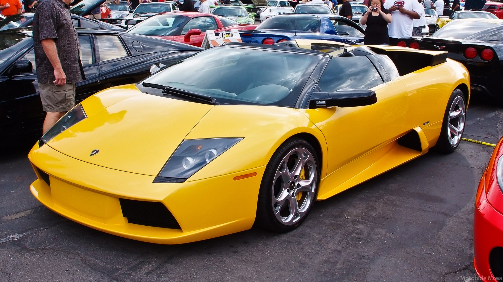 Yellow convertible with sleek angular headlights and alloy wheels