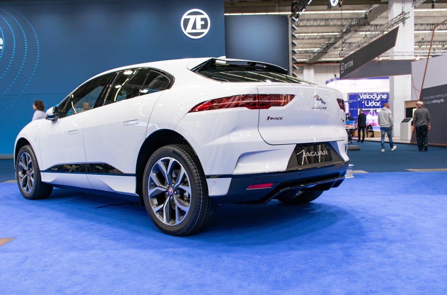 Electric SUV rear view with sleek taillights and alloy wheels