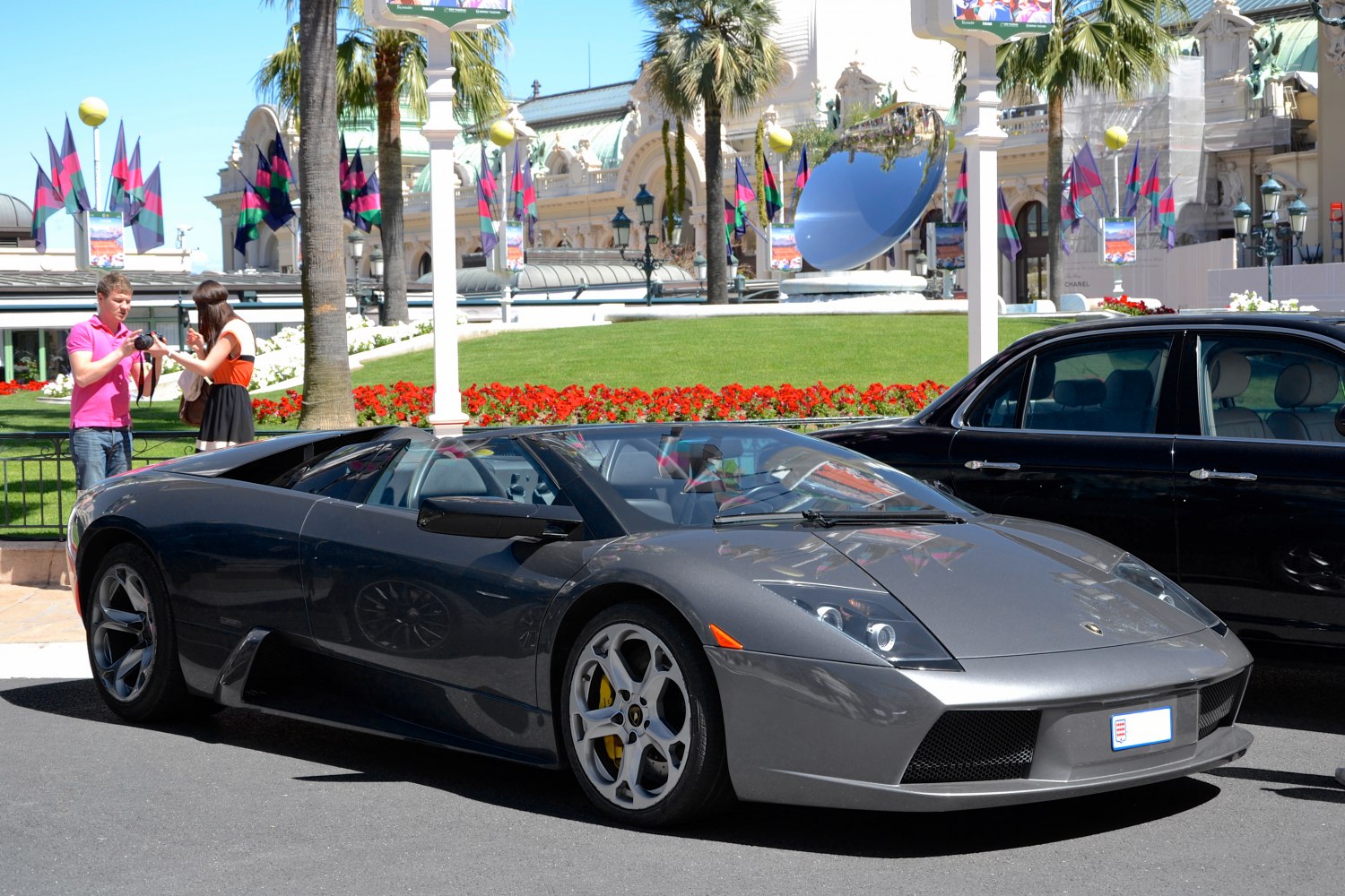 Sleek dark grey convertible with sharp headlights and aerodynamic design