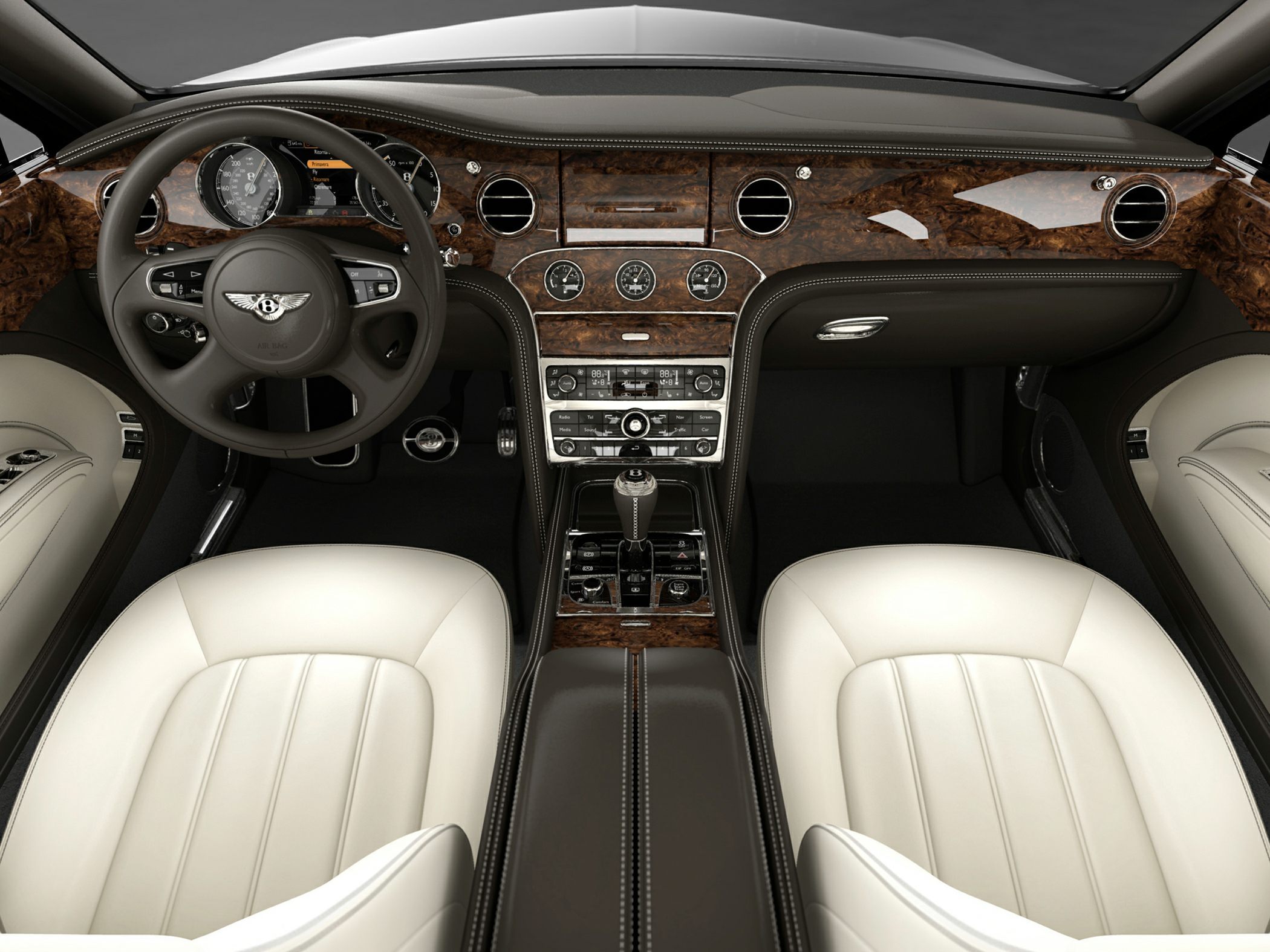 Luxury car interior with wood trim dashboard and white leather seats