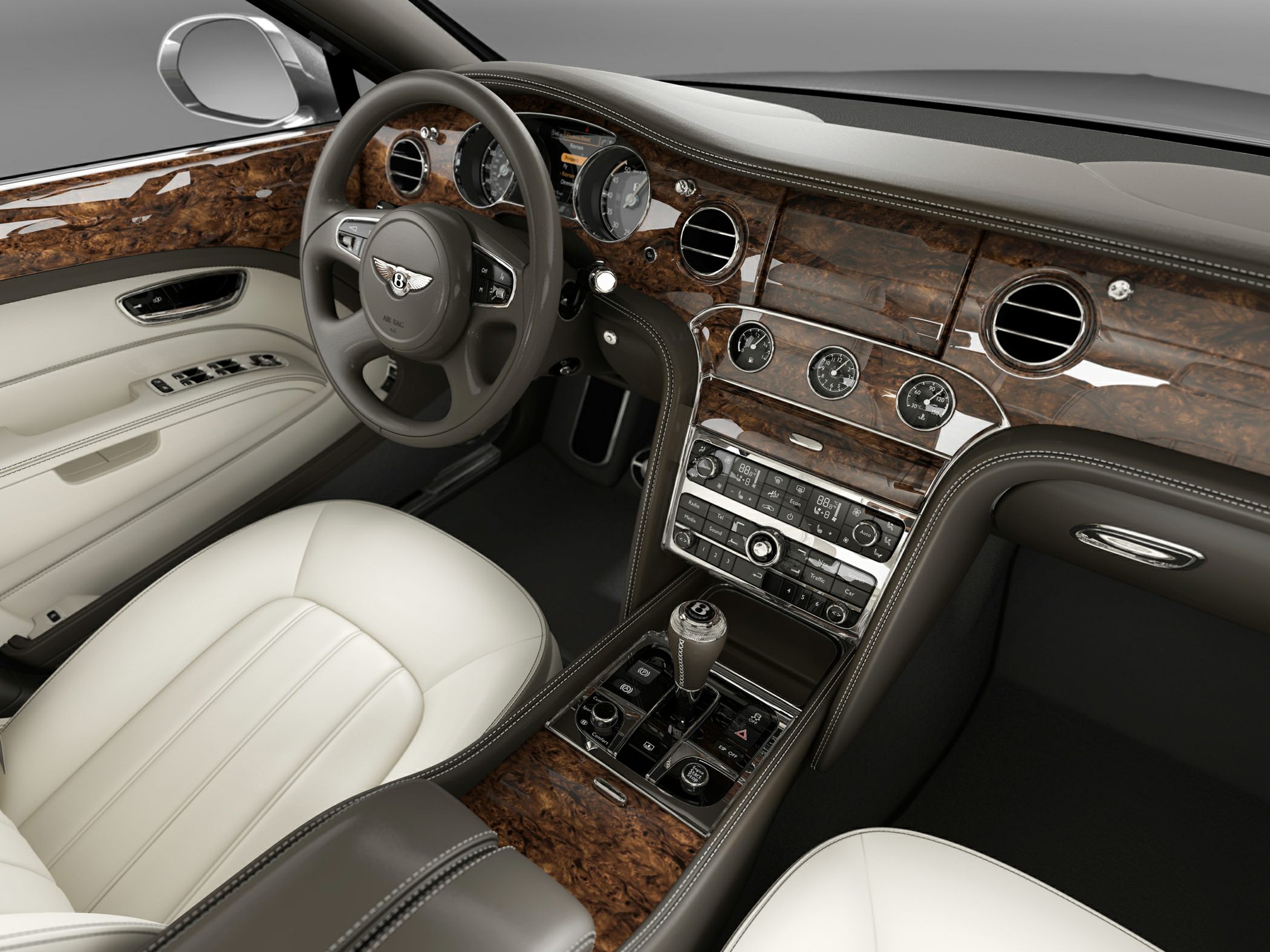 Luxury wood dashboard with beige leather seats and detailed control panel