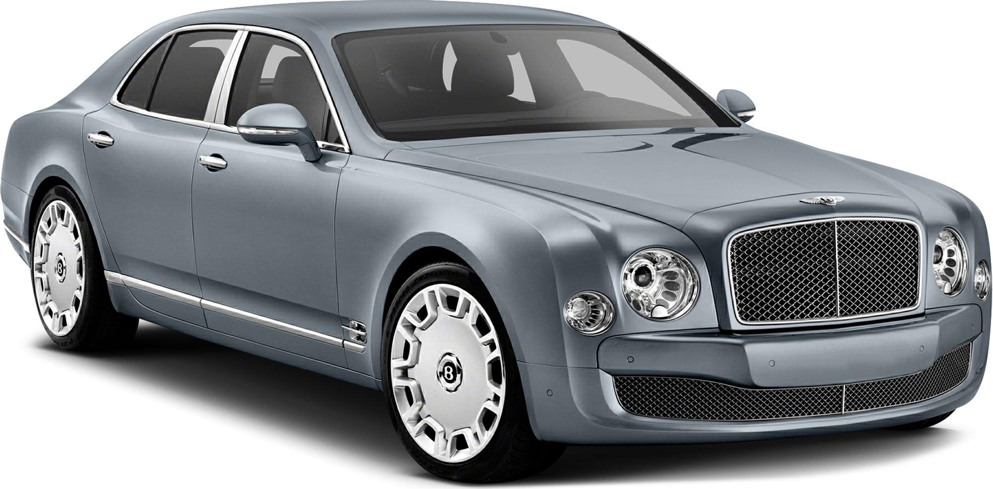 Luxury sedan with rounded headlights, mesh grille, and unique alloy wheels