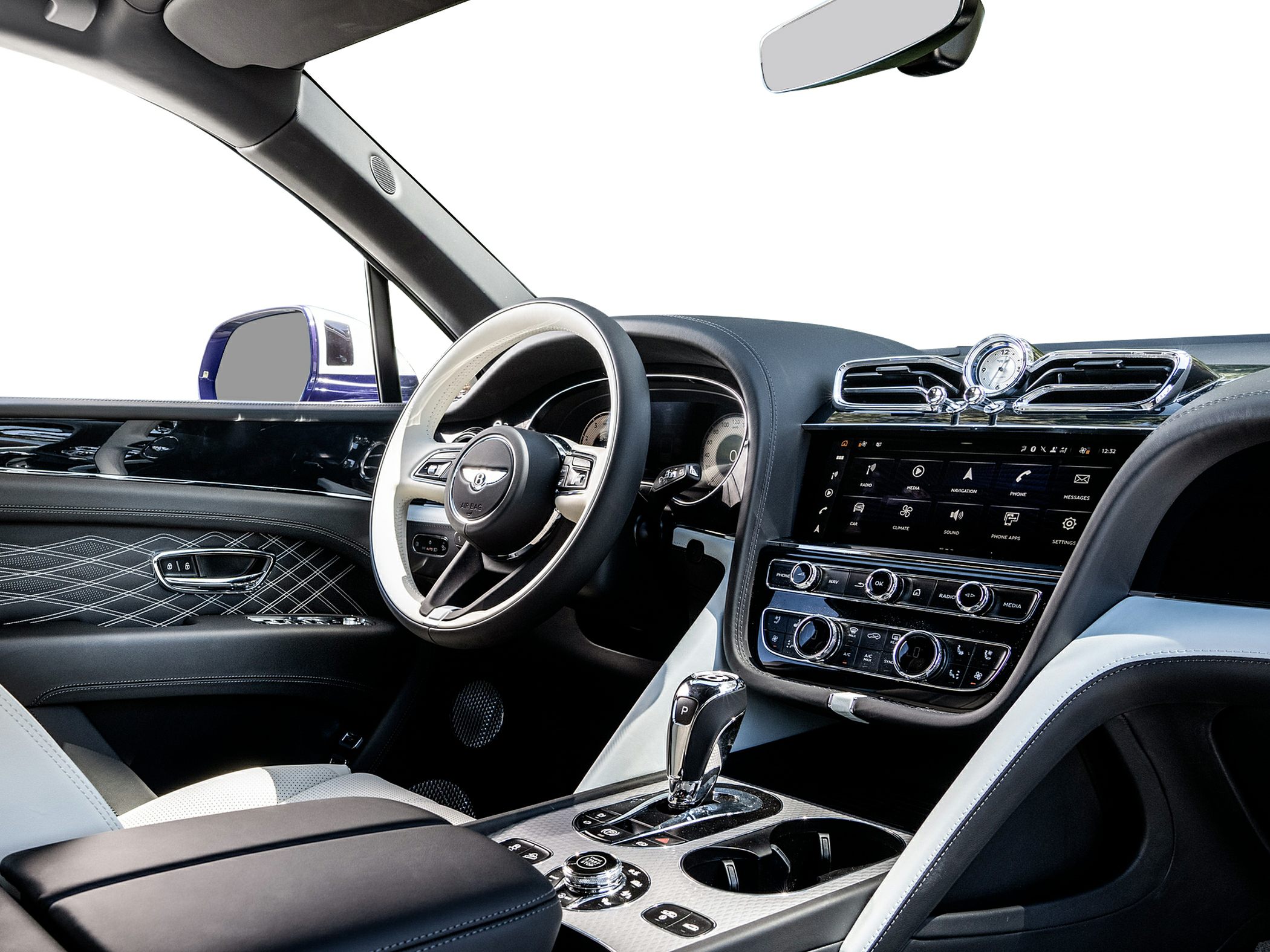 Luxury steering wheel, infotainment system, and detailed interior stitching