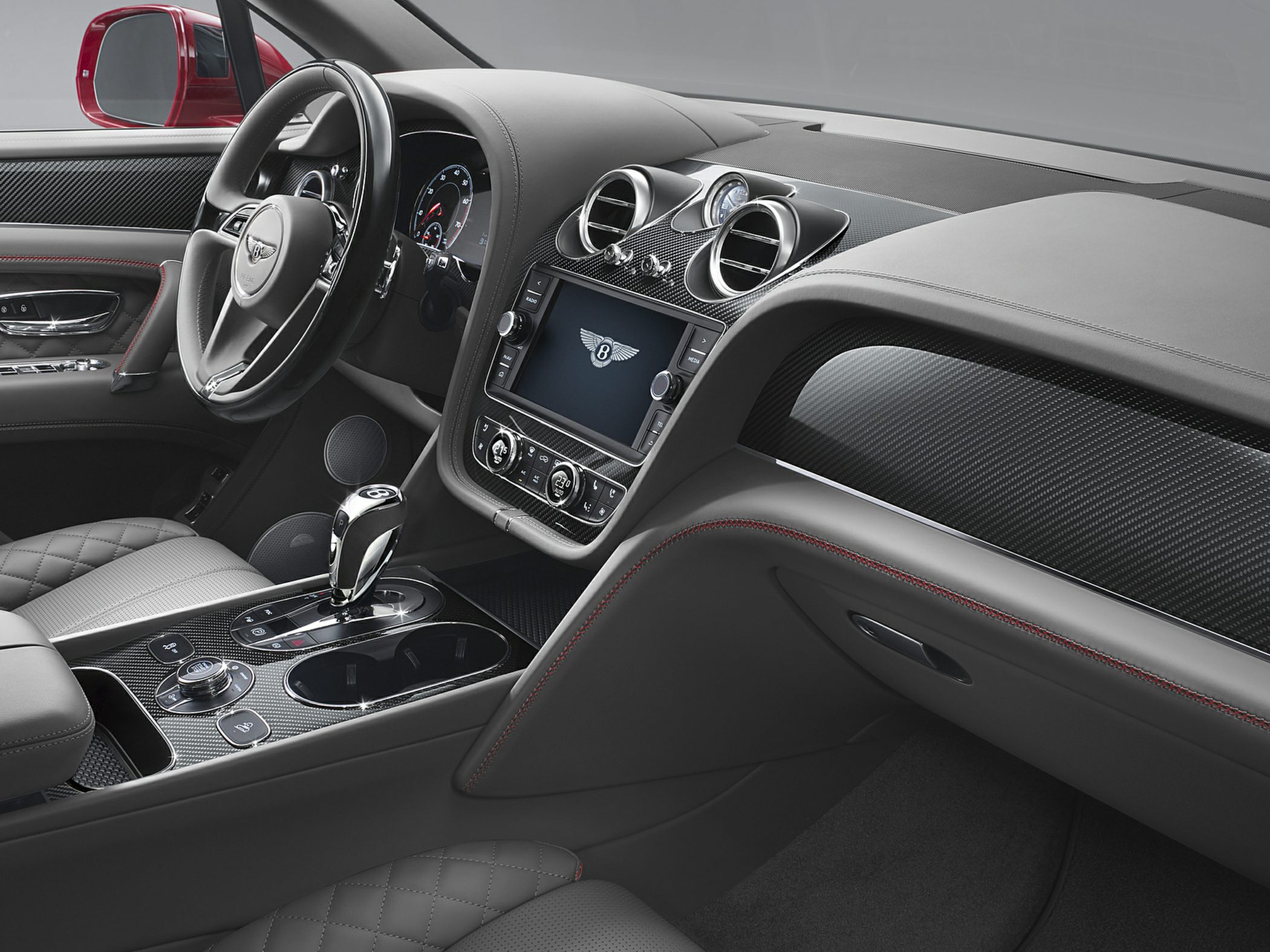 Luxury car interior with carbon fiber trim and digital display
