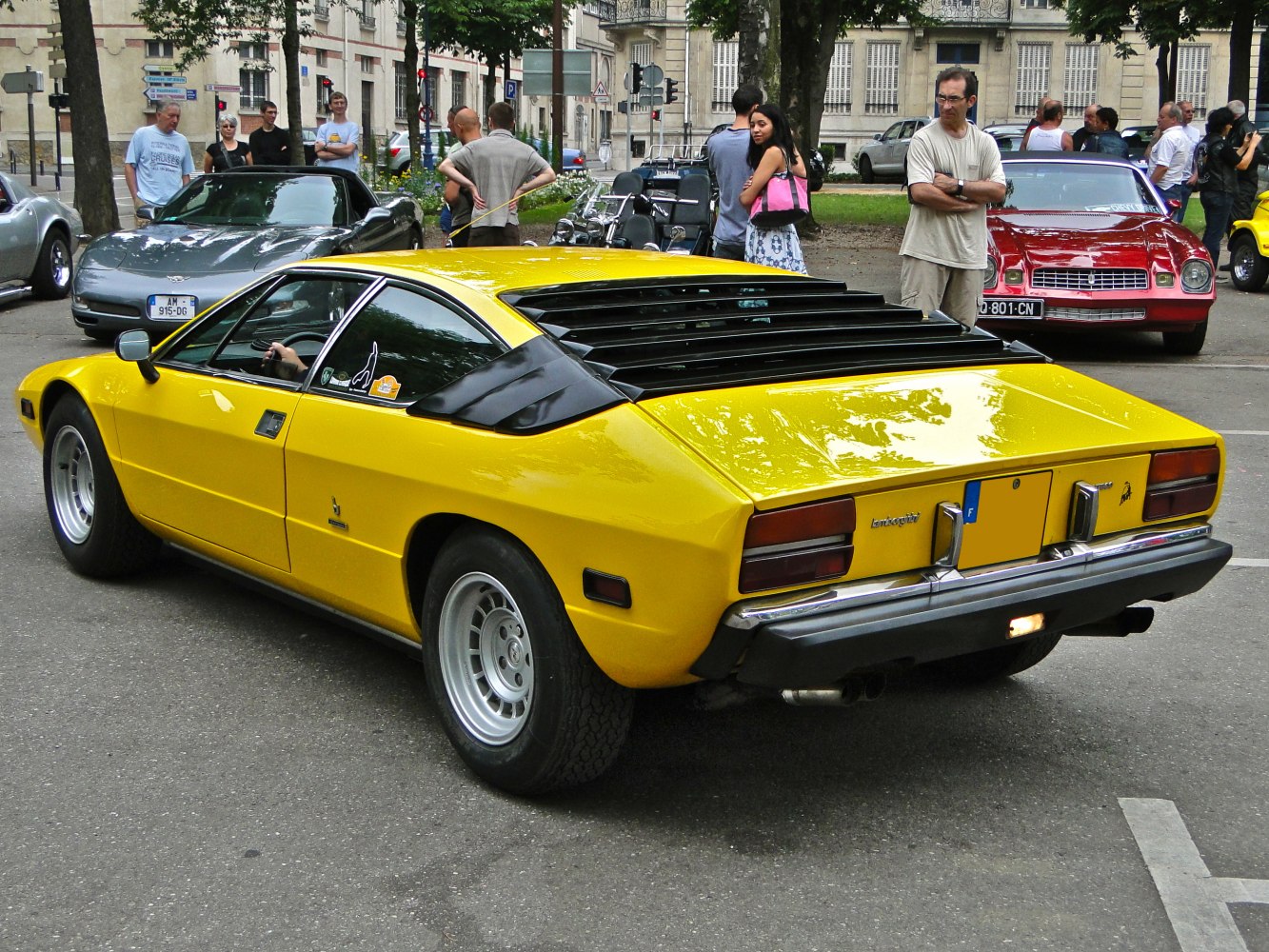 Classic car rear with horizontal louvers and angular body design.
