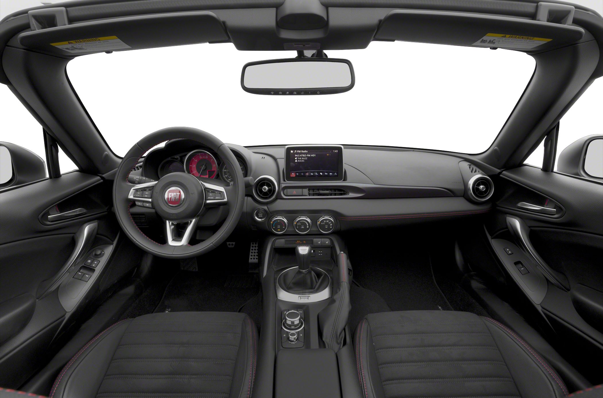 Dashboard, steering wheel, manual gear shifter, and infotainment screen