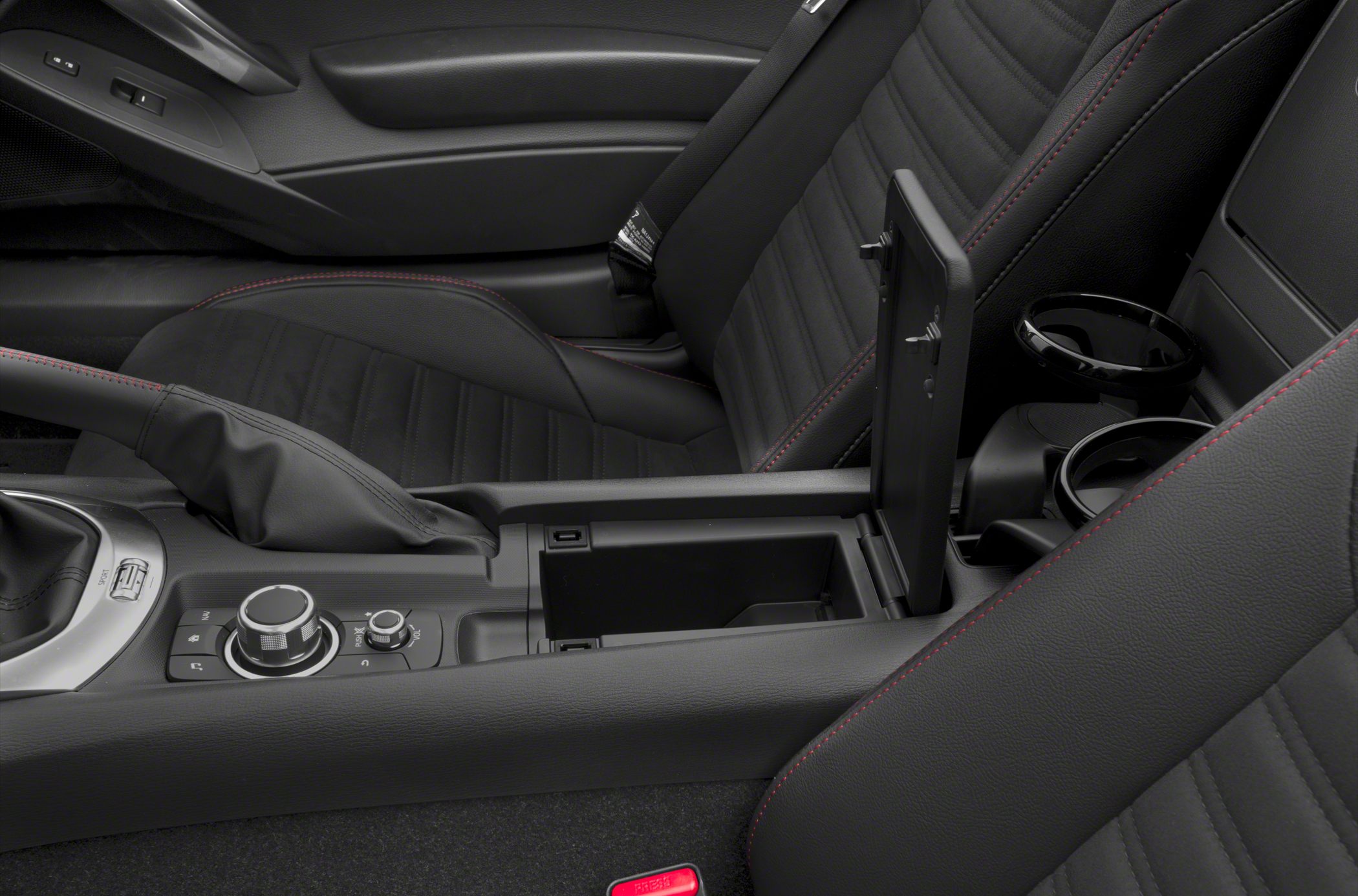 Interior center console with storage, handbrake, and control knobs