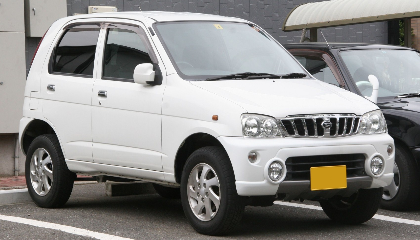 Compact SUV with round fog lights and chrome grille