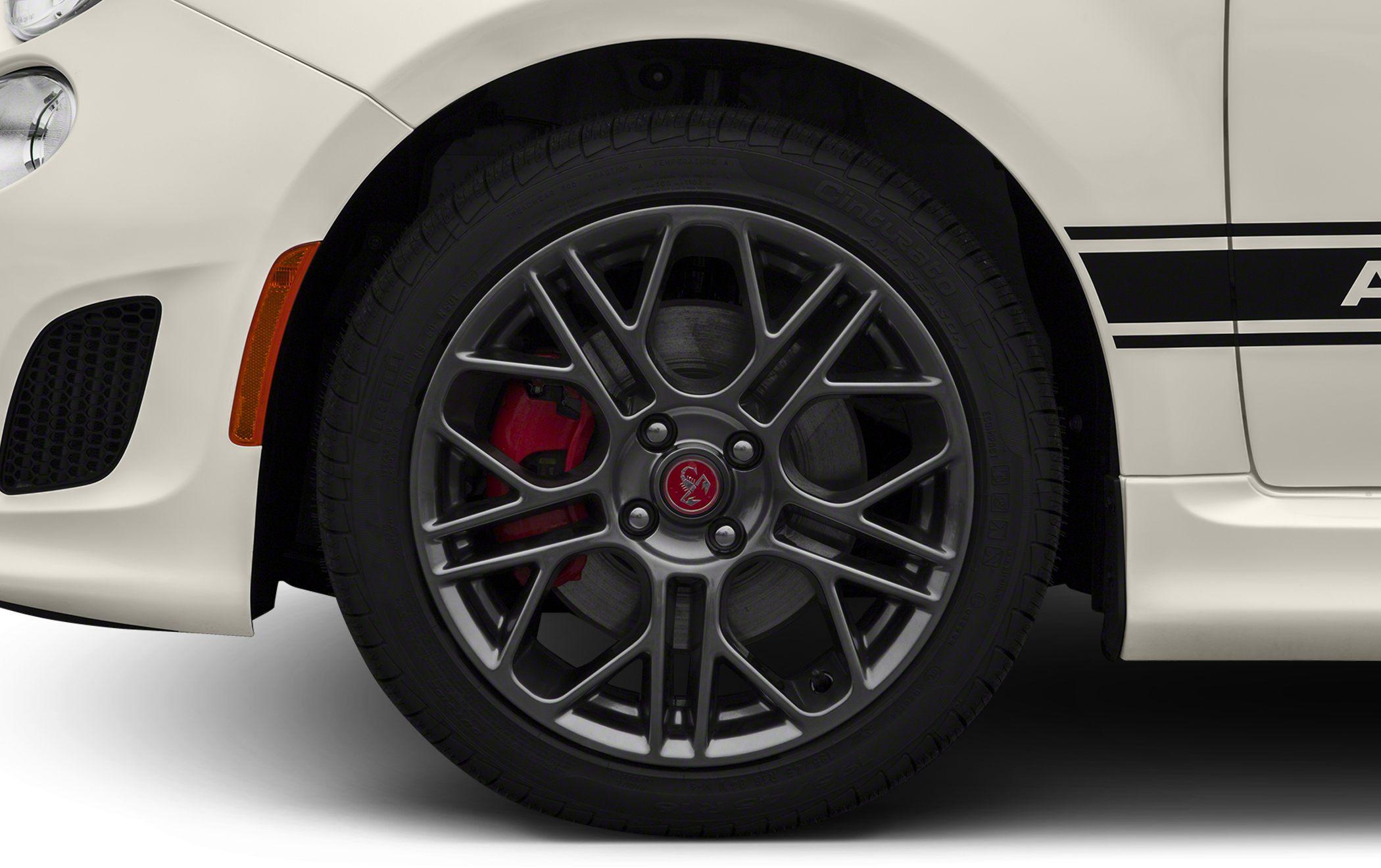 Multi-spoke alloy wheel with visible red brake caliper and disc brake